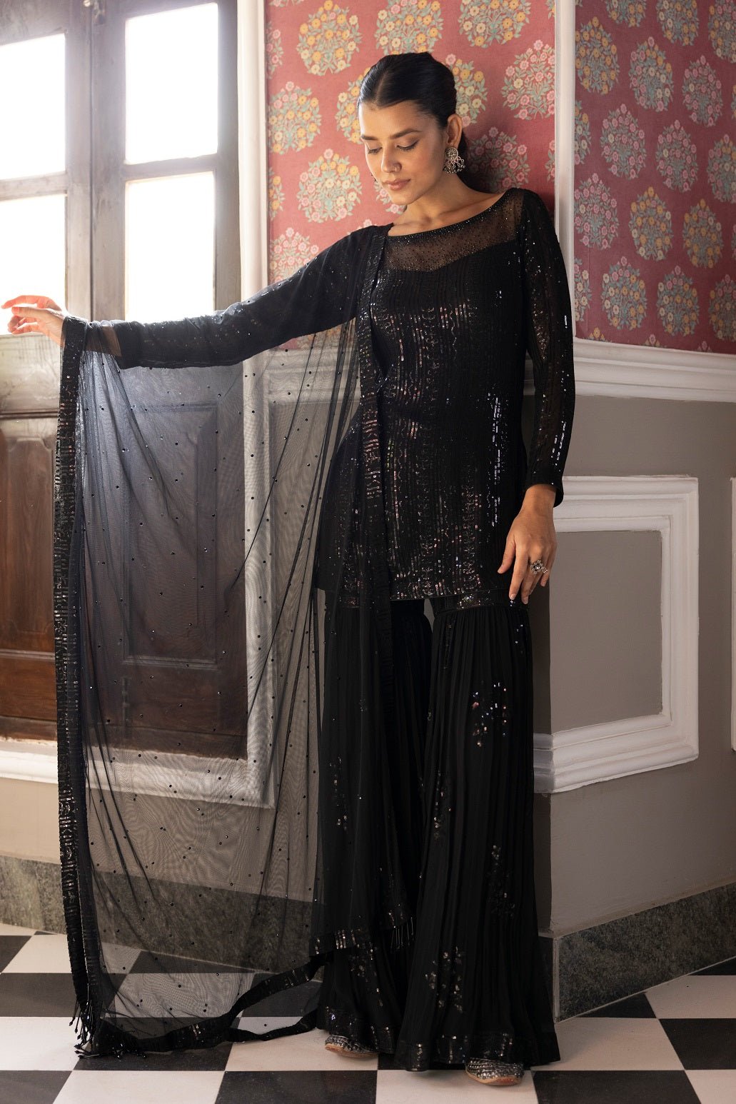 Shop beautiful black embroidered sequin sharara suit online in USA with dupatta. Dazzle on weddings and special occasions with exquisite Indian designer dresses, sharara suits, Anarkali suits, bridal lehengas, sharara suits from Pure Elegance Indian clothing store in USA.-full view