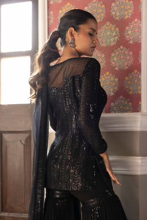 Shop beautiful black embroidered sequin sharara suit online in USA with dupatta. Dazzle on weddings and special occasions with exquisite Indian designer dresses, sharara suits, Anarkali suits, bridal lehengas, sharara suits from Pure Elegance Indian clothing store in USA.-back