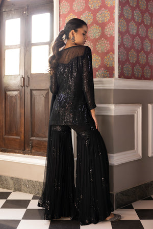 Shop beautiful black embroidered sequin sharara suit online in USA with dupatta. Dazzle on weddings and special occasions with exquisite Indian designer dresses, sharara suits, Anarkali suits, bridal lehengas, sharara suits from Pure Elegance Indian clothing store in USA.-sharara