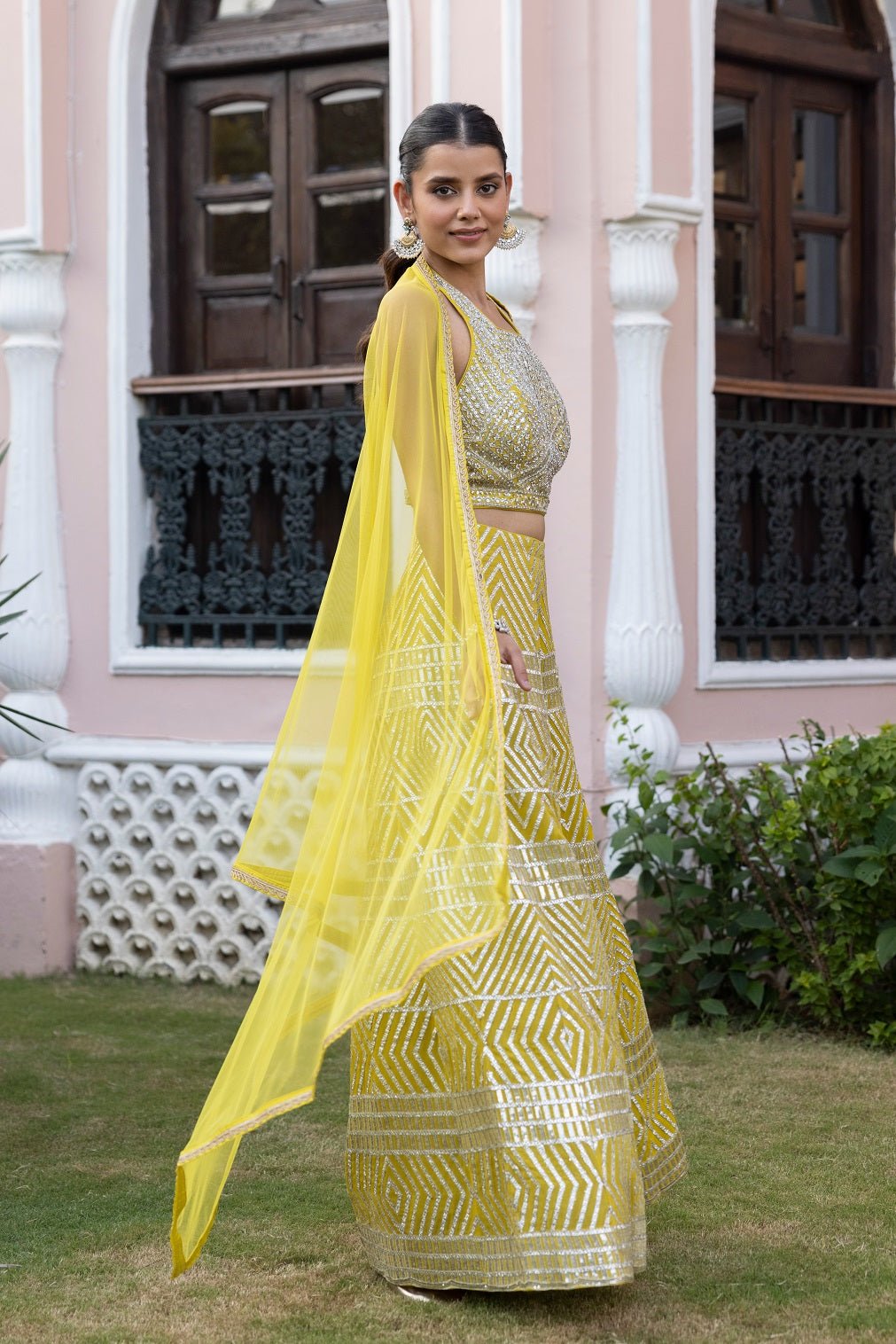 Shop lime green halter neck top online in USA with gota work pants. Dazzle on weddings and special occasions with exquisite Indian designer dresses, sharara suits, Anarkali suits, bridal lehengas, sharara suits from Pure Elegance Indian clothing store in USA.-side