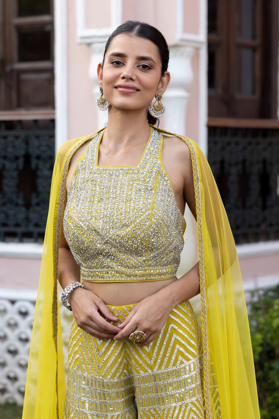 Shop lime green halter neck top online in USA with gota work pants. Dazzle on weddings and special occasions with exquisite Indian designer dresses, sharara suits, Anarkali suits, bridal lehengas, sharara suits from Pure Elegance Indian clothing store in USA.-closeup