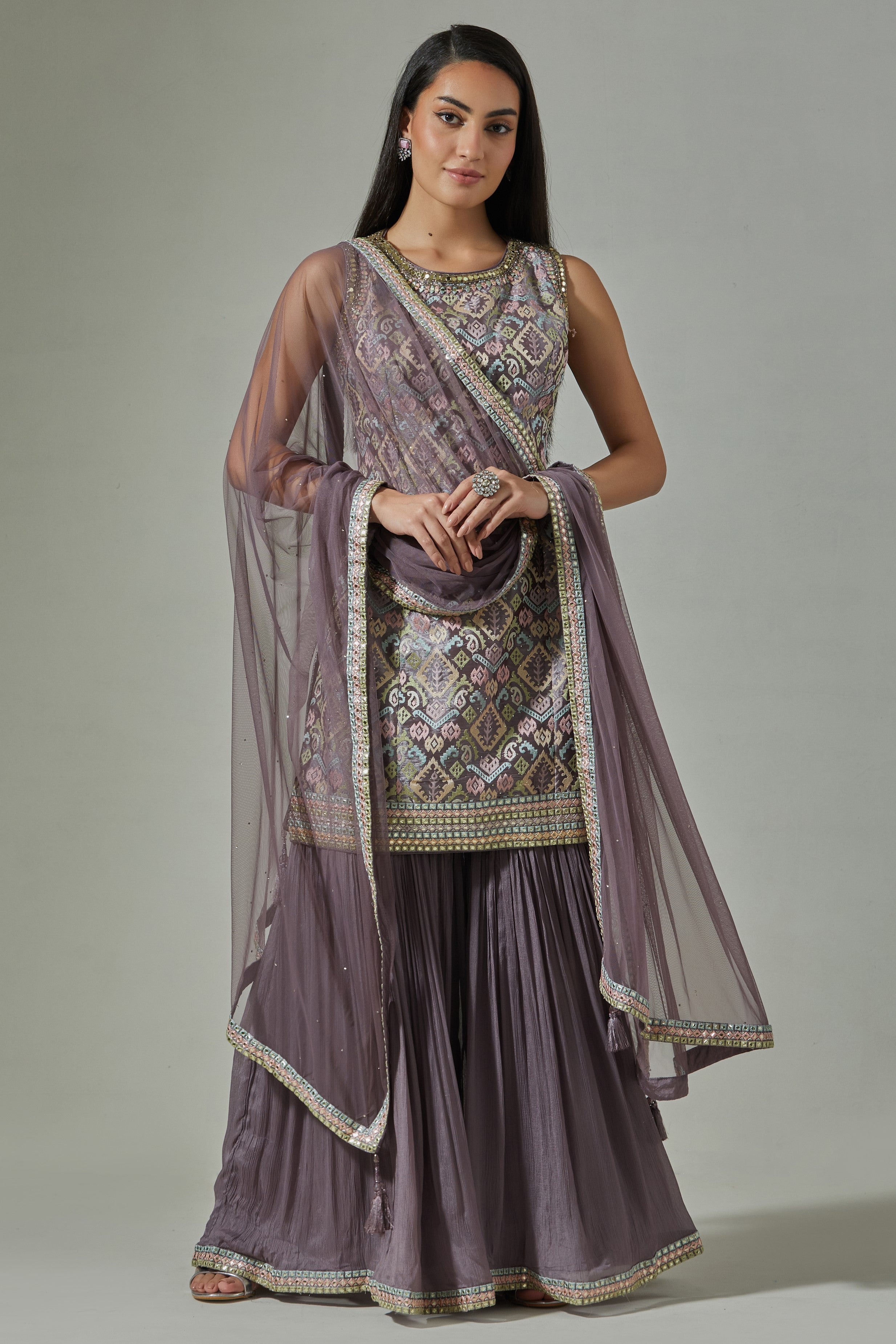 Buy stunning lilac hand embroidered jacquard sharara suit online in USA with net dupatta. Dazzle on weddings and special occasions with exquisite Indian designer dresses, sharara suits, Anarkali suits, wedding lehengas from Pure Elegance Indian fashion store in USA.-full view