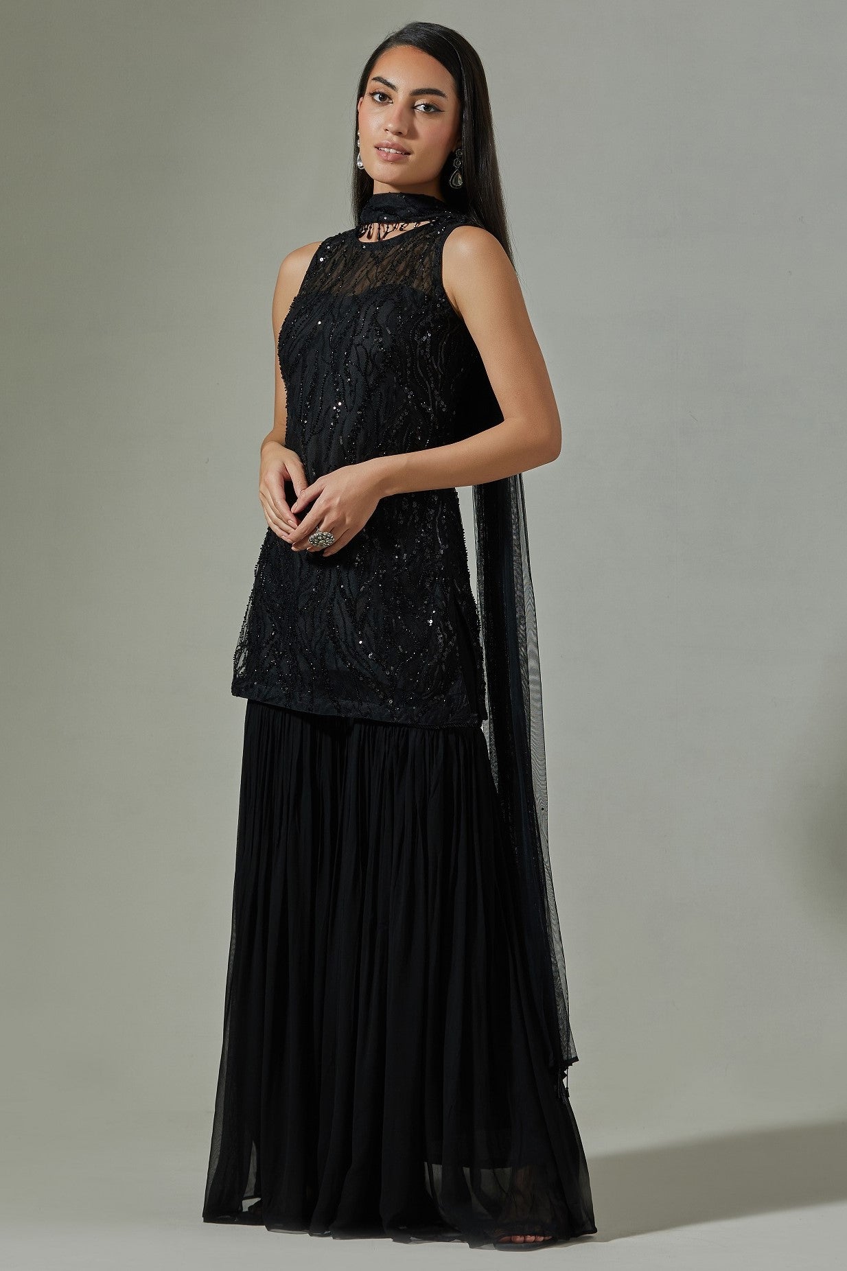 Shop beautiful black net sequin embroidery sharara suit online in USA with dupatta. Dazzle on weddings and special occasions with exquisite Indian designer dresses, sharara suits, Anarkali suits, wedding lehengas from Pure Elegance Indian fashion store in USA.-side
