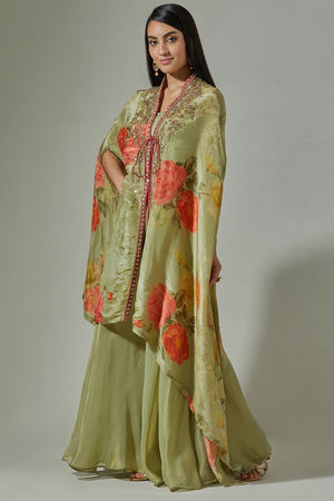 Buy beautiful pista green embroidered floral cape online in USA with sharara. Dazzle on weddings and special occasions with exquisite Indian designer dresses, sharara suits, Anarkali suits, wedding lehengas from Pure Elegance Indian fashion store in USA.-side