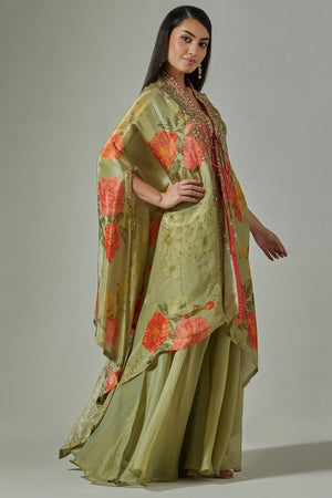 Buy beautiful pista green embroidered floral cape online in USA with sharara. Dazzle on weddings and special occasions with exquisite Indian designer dresses, sharara suits, Anarkali suits, wedding lehengas from Pure Elegance Indian fashion store in USA.-right