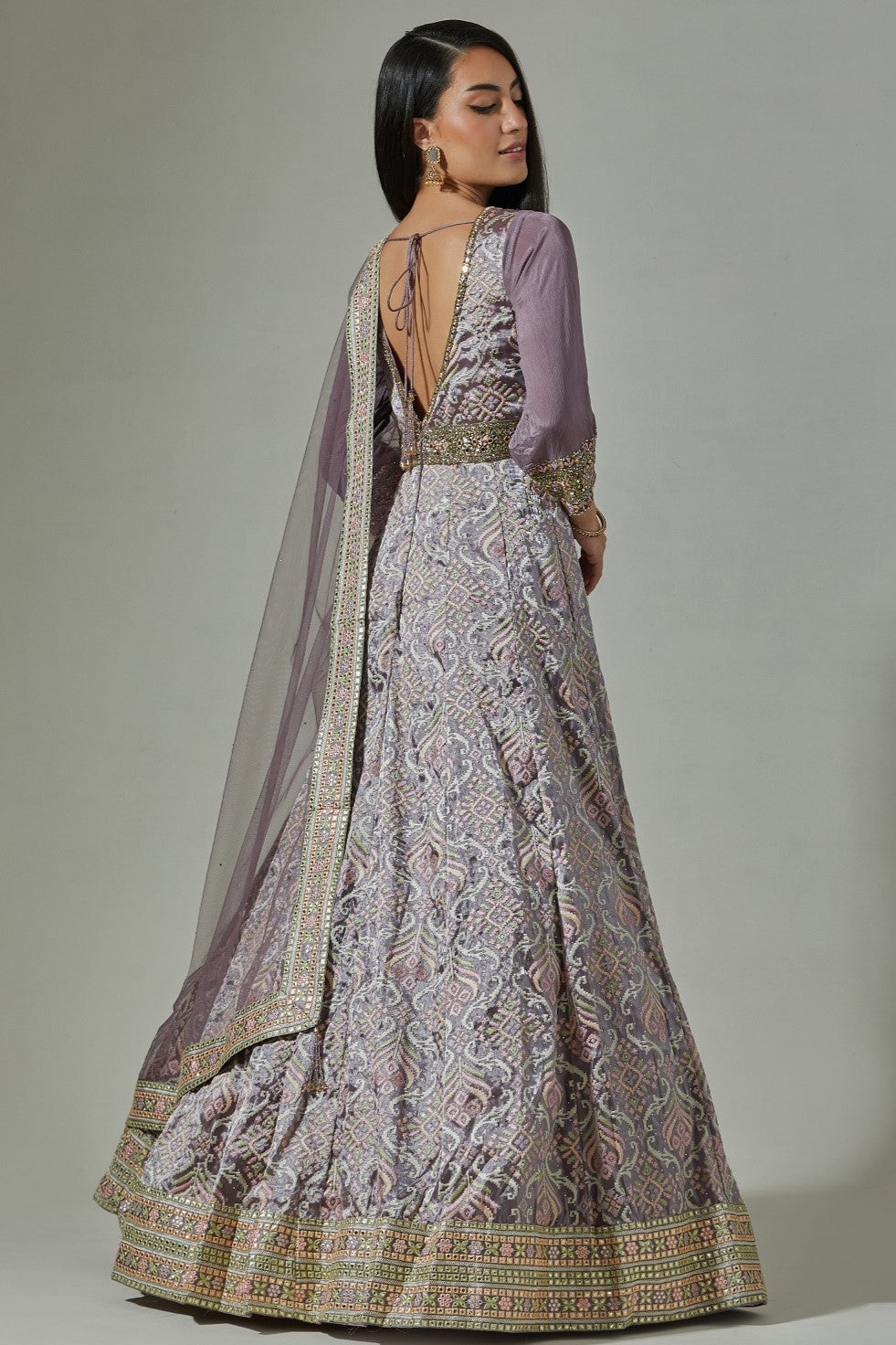Shop beautiful lilac jacquard weave embroidered Anarkali suit online in USA. Dazzle on weddings and special occasions with exquisite Indian designer dresses, sharara suits, Anarkali suits, wedding lehengas from Pure Elegance Indian fashion store in USA.-back