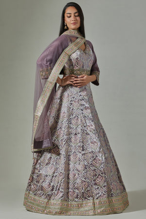 Shop beautiful lilac jacquard weave embroidered Anarkali suit online in USA. Dazzle on weddings and special occasions with exquisite Indian designer dresses, sharara suits, Anarkali suits, wedding lehengas from Pure Elegance Indian fashion store in USA.-side
