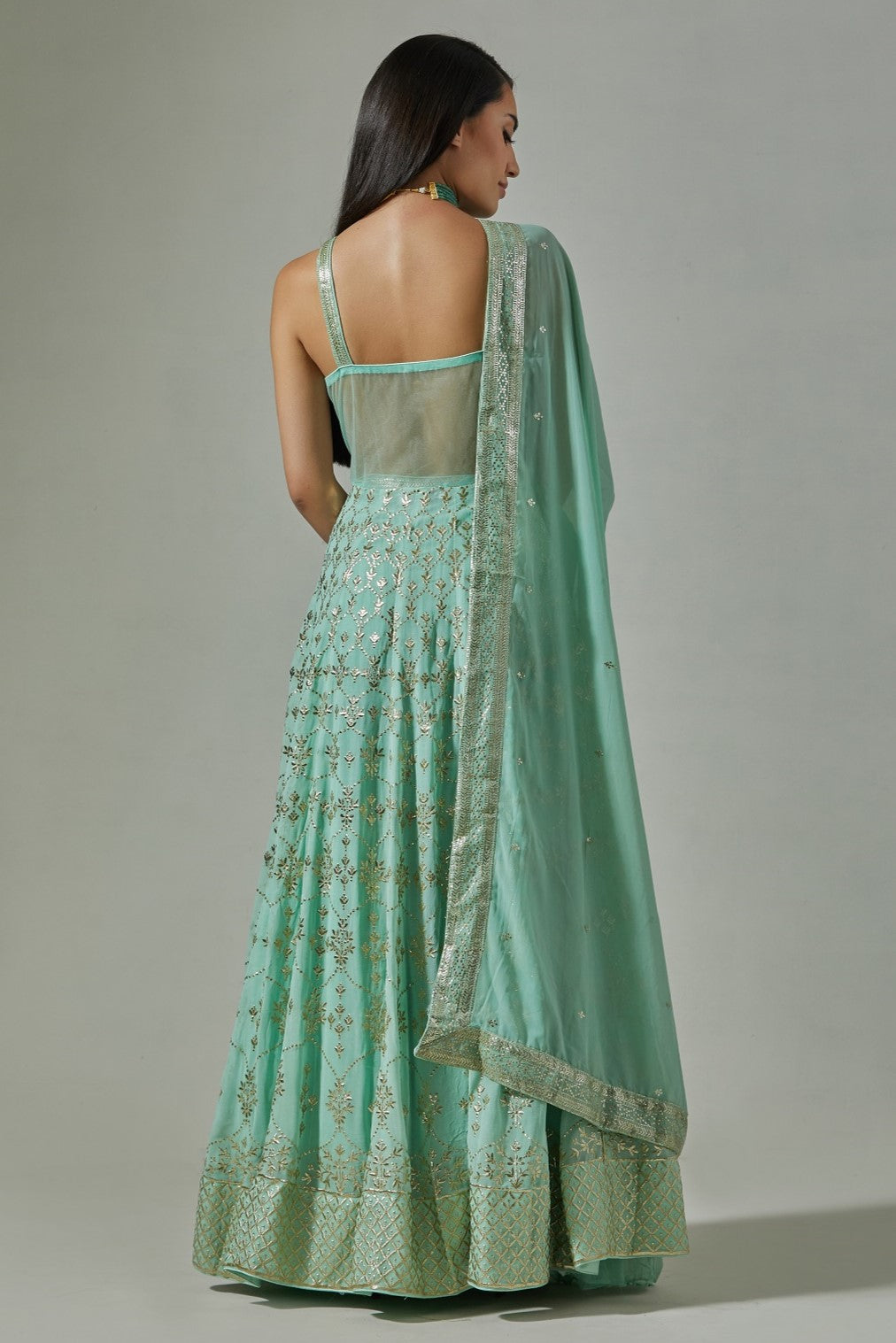 Buy beautiful sea green embroidered floorlength Anarkali suit online in USA. Dazzle on weddings and special occasions with exquisite Indian designer dresses, sharara suits, Anarkali suits, wedding lehengas from Pure Elegance Indian fashion store in USA.-back