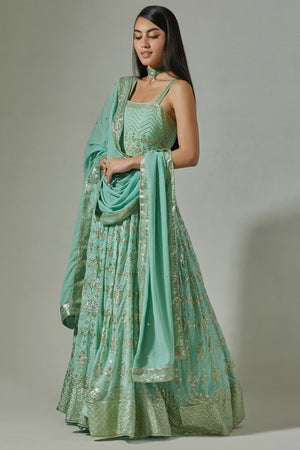 Buy beautiful sea green embroidered floorlength Anarkali suit online in USA. Dazzle on weddings and special occasions with exquisite Indian designer dresses, sharara suits, Anarkali suits, wedding lehengas from Pure Elegance Indian fashion store in USA.-left