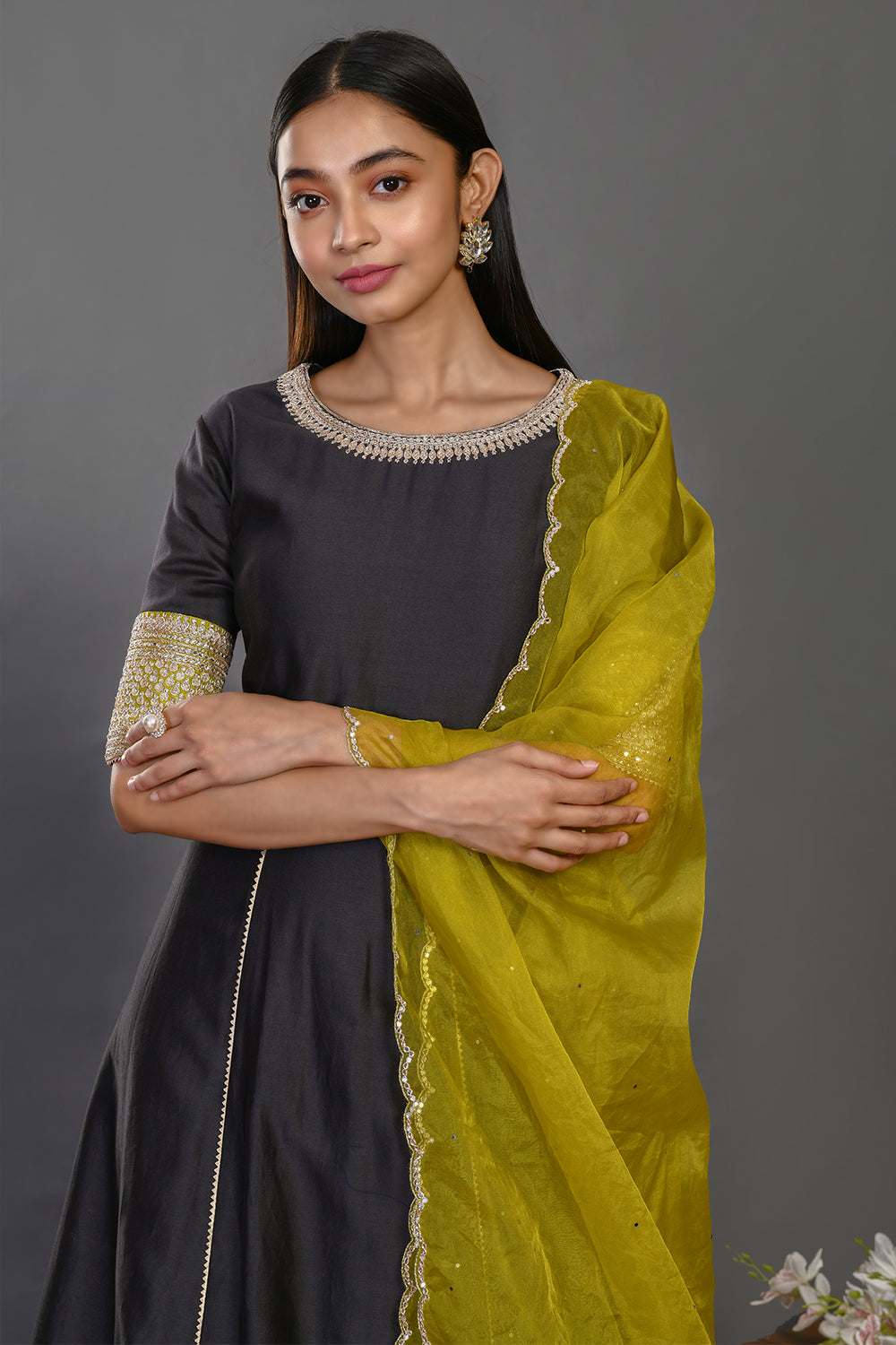 Shop black floorlength chanderi Anarkali online in USA with embroidered yellow dupatta. Dazzle on weddings and special occasions with exquisite Indian designer dresses, sharara suits, Anarkali suits, wedding lehengas from Pure Elegance Indian fashion store in USA.-closeup