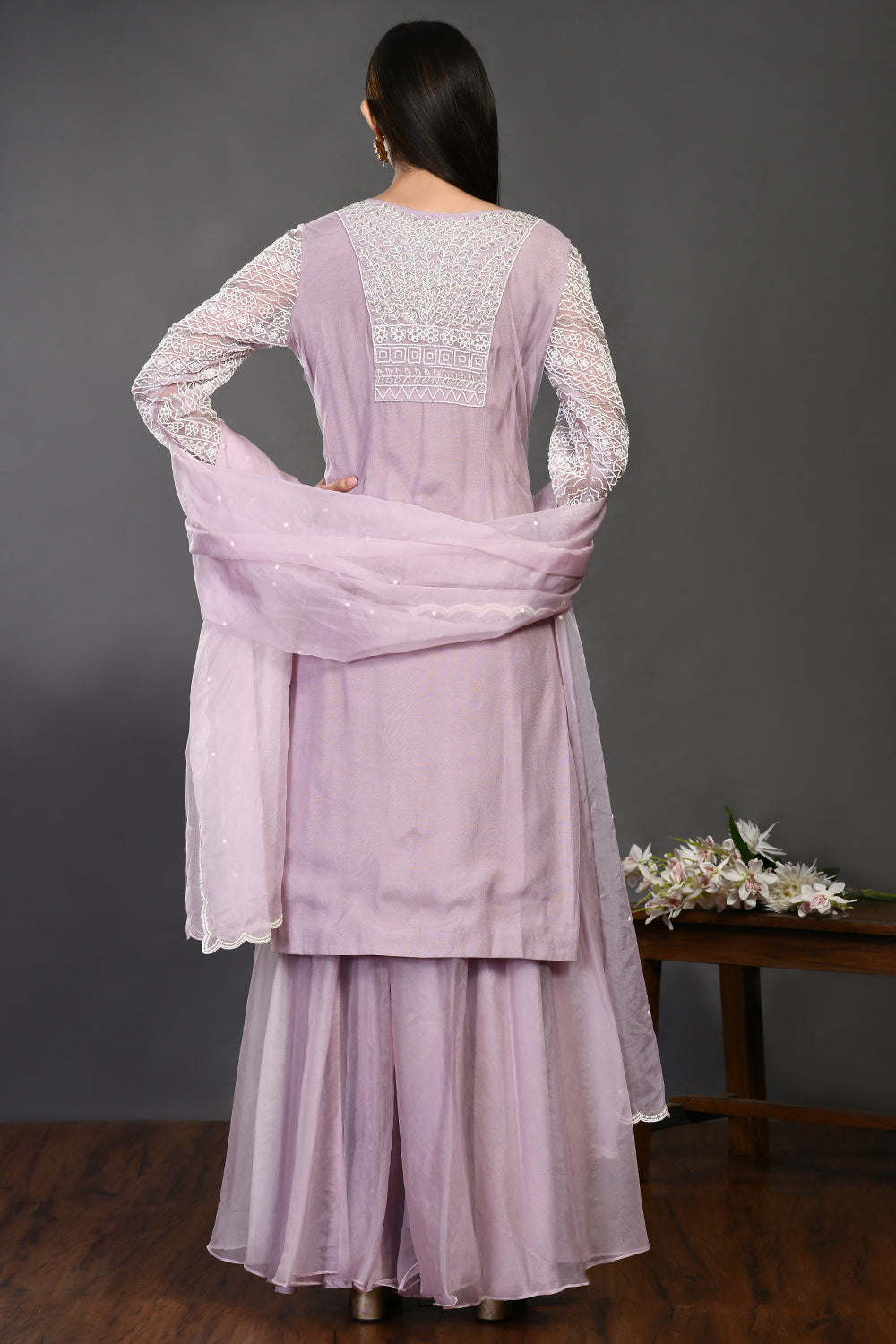 Buy lilac pearl and cutdana work organza sharara suit online in USA with dupatta. Dazzle on weddings and special occasions with exquisite Indian designer dresses, sharara suits, Anarkali suits, wedding lehengas from Pure Elegance Indian fashion store in USA.-back