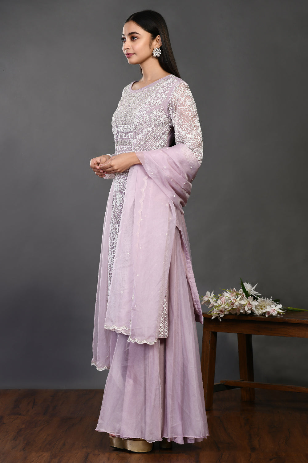 Buy lilac pearl and cutdana work organza sharara suit online in USA with dupatta. Dazzle on weddings and special occasions with exquisite Indian designer dresses, sharara suits, Anarkali suits, wedding lehengas from Pure Elegance Indian fashion store in USA.-side