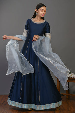 Shop navy blue floorlength chanderi Anarkali suit online in USA with dupatta. Dazzle on weddings and special occasions with exquisite Indian designer dresses, sharara suits, Anarkali suits, wedding lehengas from Pure Elegance Indian fashion store in USA.-front