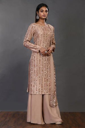 Shop beige embellished Mysore silk suit online in USA with dupatta. Dazzle on weddings and special occasions with exquisite Indian designer dresses, sharara suits, Anarkali suits, wedding lehengas from Pure Elegance Indian fashion store in USA.-right