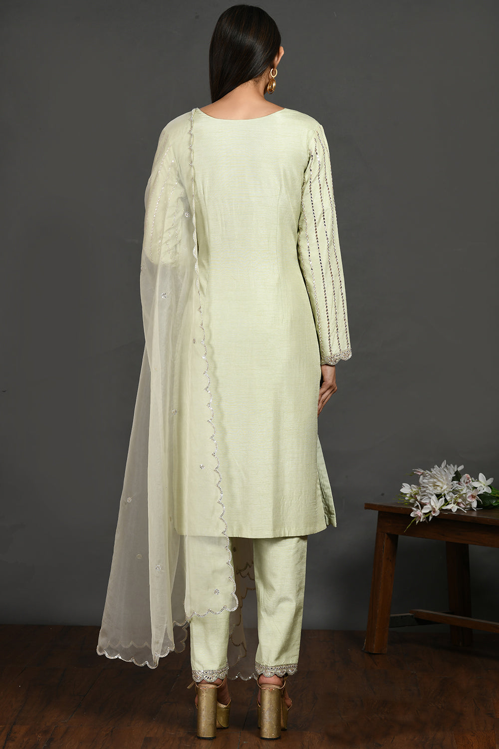 Buy mint green mirror work silk suit online in USA with organza dupatta. Dazzle on weddings and special occasions with exquisite Indian designer dresses, sharara suits, Anarkali suits, wedding lehengas from Pure Elegance Indian fashion store in USA.-back