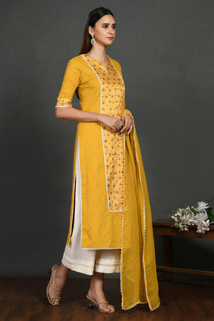 Shop yellow stone and pearl work chanderi suit online in USA with dupatta. Dazzle on weddings and special occasions with exquisite Indian designer dresses, sharara suits, Anarkali suits, wedding lehengas from Pure Elegance Indian fashion store in USA.-right