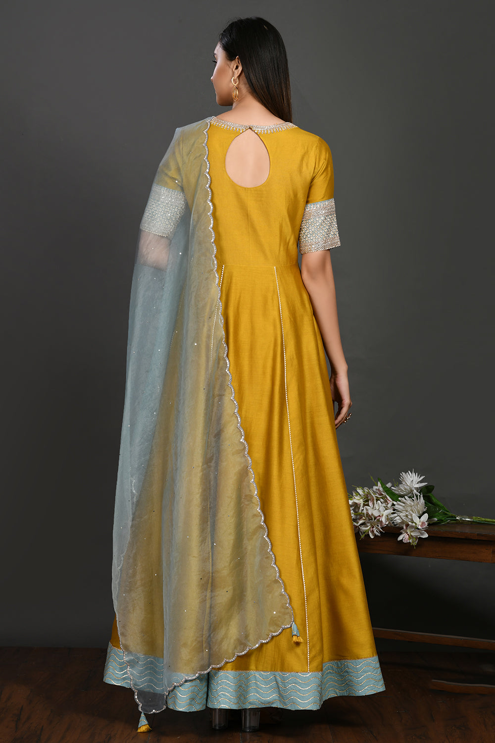 Buy yellow floorlength chanderi Anarkali online in USA with blue dupatta. Dazzle on weddings and special occasions with exquisite Indian designer dresses, sharara suits, Anarkali suits, wedding lehengas from Pure Elegance Indian fashion store in USA.-back