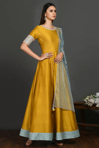 Buy yellow floorlength chanderi Anarkali online in USA with blue dupatta. Dazzle on weddings and special occasions with exquisite Indian designer dresses, sharara suits, Anarkali suits, wedding lehengas from Pure Elegance Indian fashion store in USA.-full view