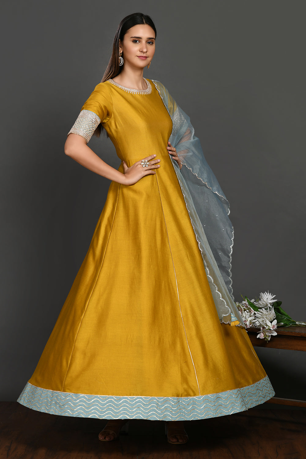 Buy yellow floorlength chanderi Anarkali online in USA with blue dupatta. Dazzle on weddings and special occasions with exquisite Indian designer dresses, sharara suits, Anarkali suits, wedding lehengas from Pure Elegance Indian fashion store in USA.-right