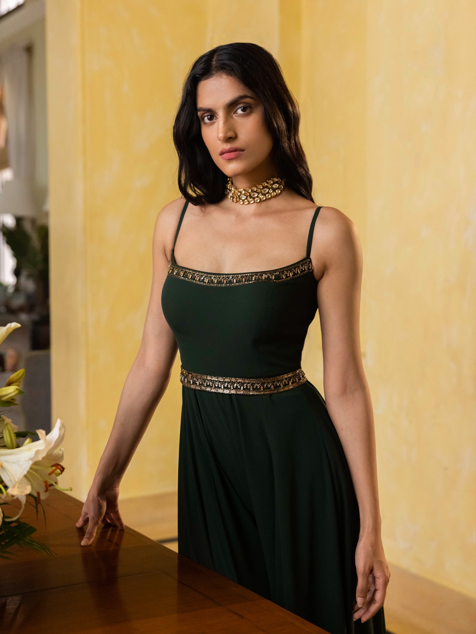 Buy a beautiful green lightwork embroidered georgette jumpsuit with an embroidered belt. The suit is perfect for occasions like dinners and parties. Dazzle on weddings and special occasions with exquisite Indian designer dresses, sharara suits, Anarkali suits, and wedding lehengas from Pure Elegance Indian fashion store in USA.