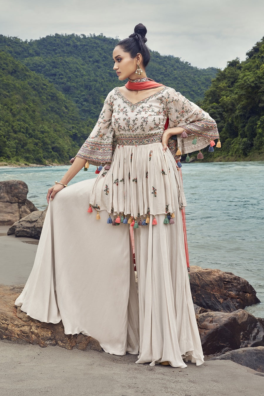 Shop the cynosure of all eyes as you flaunt this set of grey sharara set with a red dupatta from Pure Elegance. Complete the look by wearing statement jewelry and heels. Perfect for functions and parties  Buy the look from Pure Elegance Indian clothing store in the USA online now.