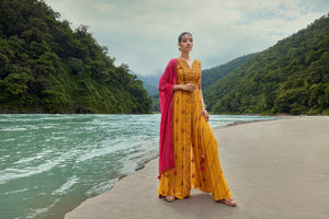 Buy this beautiful yellow embroidered georgette sharara suit with red dupatta. Shop online from Pure Elegance. online in the USA with a dupatta. Dazzle on weddings and special occasions with exquisite Indian designer dresses, sharara suits, Anarkali suits, and wedding lehengas from Pure Elegance Indian fashion store in the USA.