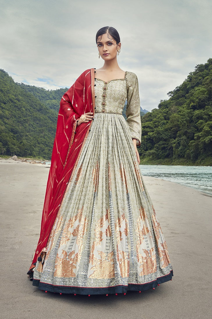 Buy this Beautiful grey embroidered georgette anarkali suit with a red dupatta. Shop online from Pure Elegance. online in the USA with a dupatta. Dazzle on weddings and special occasions with exquisite Indian designer dresses, sharara suits, Anarkali suits, and wedding lehengas from Pure Elegance Indian fashion store in the USA.