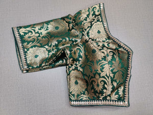Buy classic is never old and enough to have in your closet! Pair this fashionable dark green color blouse with any silk designer saree and statement neck piece and you are good to go! Elevate your Indian saree style with exquisite readymade sari blouse, embroidered saree blouses, Banarasi sari blouse, and designer sari blouse from Pure Elegance Indian clothing store in USA.-Folded View