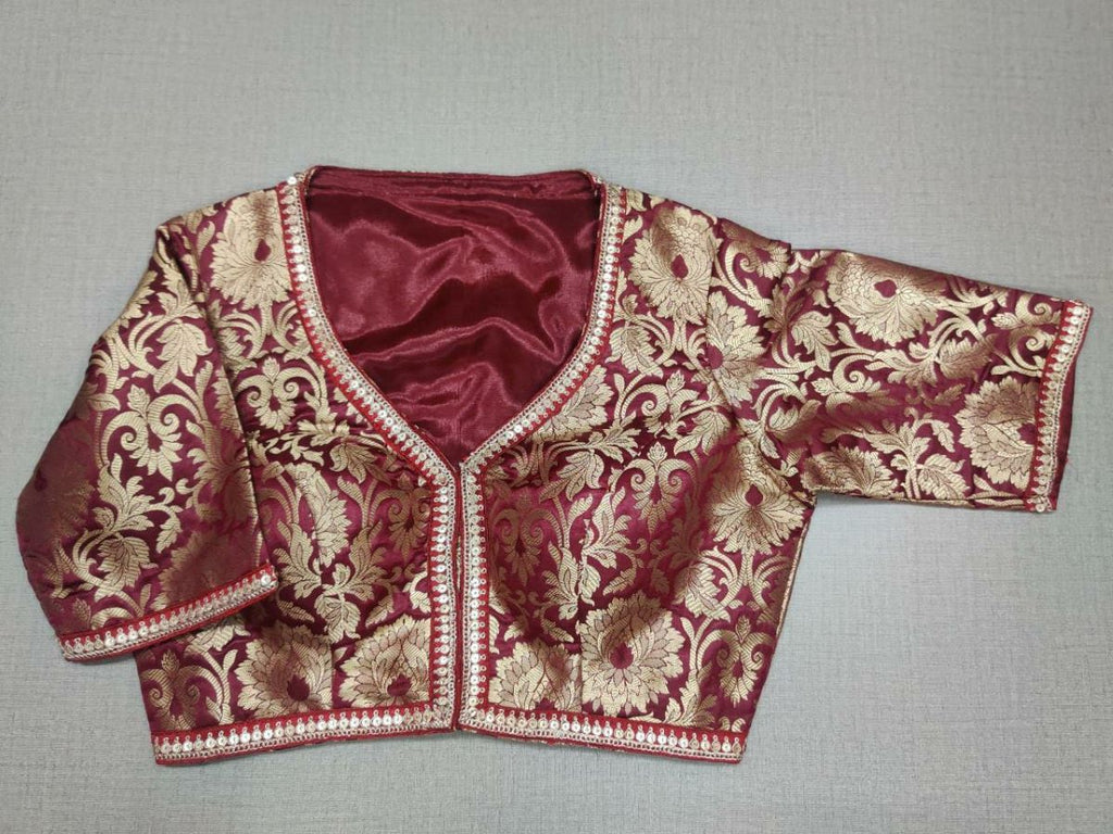 Buy classic is never old and enough to have in your closet! Pair this fashionable maroon color blouse with any silk designer saree and statement neck piece and you are good to go! Elevate your Indian saree style with exquisite readymade sari blouse, embroidered saree blouses, Banarasi sari blouse, and designer sari blouse from Pure Elegance Indian clothing store in USA.- Front View