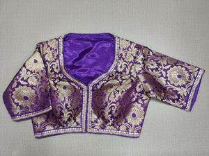 Buy classic is never old and enough to have in your closet! Pair this fashionable purple color blouse with any silk designer saree and statement neck piece and you are good to go! Elevate your Indian saree style with exquisite readymade sari blouse, embroidered saree blouses, Banarasi sari blouse, and designer sari blouse from Pure Elegance Indian clothing store in USA.- Front View