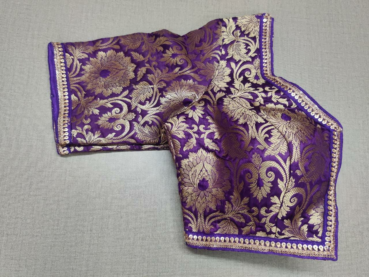 Buy classic is never old and enough to have in your closet! Pair this fashionable purple color blouse with any silk designer saree and statement neck piece and you are good to go! Elevate your Indian saree style with exquisite readymade sari blouse, embroidered saree blouses, Banarasi sari blouse, and designer sari blouse from Pure Elegance Indian clothing store in USA.- Folded View