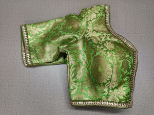 Buy classic is never old and enough to have in your closet! Pair this fashionable green color blouse with any silk designer saree and statement neck piece and you are good to go! Elevate your Indian saree style with exquisite readymade sari blouse, embroidered saree blouses, Banarasi sari blouse, and designer sari blouse from Pure Elegance Indian clothing store in USA.-Folded View