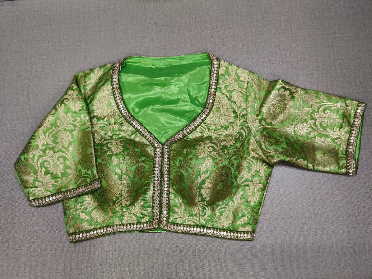 Buy classic is never old and enough to have in your closet! Pair this fashionable green color blouse with any silk designer saree and statement neck piece and you are good to go! Elevate your Indian saree style with exquisite readymade sari blouse, embroidered saree blouses, Banarasi sari blouse, and designer sari blouse from Pure Elegance Indian clothing store in USA.-Front View