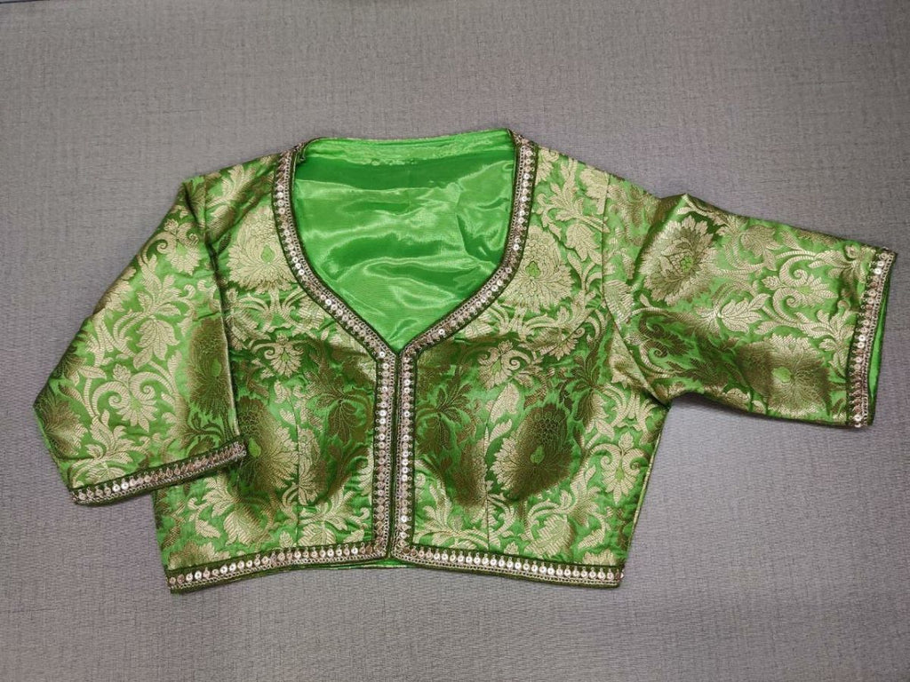 Buy classic is never old and enough to have in your closet! Pair this fashionable green color blouse with any silk designer saree and statement neck piece and you are good to go! Elevate your Indian saree style with exquisite readymade sari blouse, embroidered saree blouses, Banarasi sari blouse, and designer sari blouse from Pure Elegance Indian clothing store in USA.-Front View
