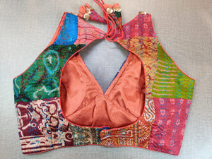 Buy this blouse as a rich add-on to glam up your look. Team this multi-color blouse with a lovely silk saree to look gorgeous and create a stunning and beautiful look. It has a V neck in front, a beautiful back with hook closure, and tassels. Elevate your Indian saree style with exquisite readymade sari blouse, embroidered saree blouses, Banarasi sari blouse, and designer sari blouse from Pure Elegance Indian clothing store in the USA.- Back View