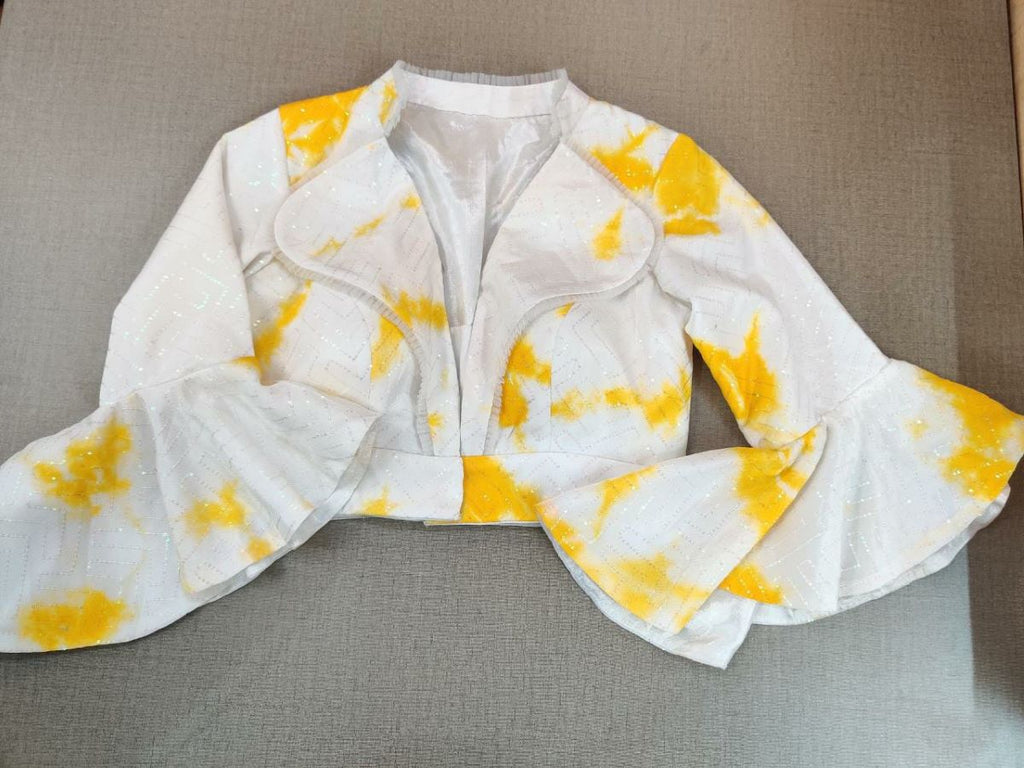 Buy this blouse as a rich add-on to glam up your look. Team this white yellow blouse with a lovely yellow silk saree to look gorgeous and create a stunning and beautiful look. It has a V neck in front with a collar, a beautiful back, and a hook closure in front. Buy this designer blouse in the USA from Pure Elegance. - Front VIew