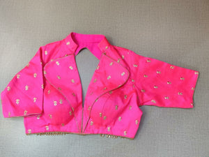 Buy a pink silk saree blouse that has a shirt-style collar beautiful neck, three-quarter sleeves, and hook closure. Pink blouse crafted in hammered silk with beautiful embroidery work. This charming blouse surely fetches you compliments for your rich sense of style. Complement your look with statement jewelry and high heels to complete the ensemble. Buy this designer blouse in the USA from Pure Elegance. - Front View