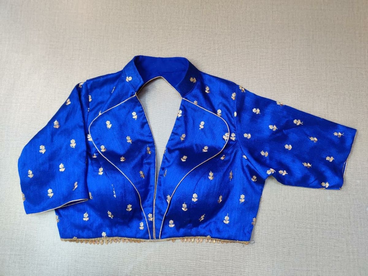 Buy a dark blue silk saree blouse that has a shirt collar neck, three-quarter sleeves, and hook closure. Blue blouse crafted in hammered silk with beautiful embroidery work. This charming blouse surely fetches you compliments for your rich sense of style. Complement your look with statement jewelry and high heels to complete the ensemble. Buy this designer blouse in the USA from Pure Elegance. - Front View