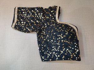 Buy this blouse to righten up your festive nights with this enchanting black sequin embroidered sleeveless blouse. Featuring sequin embroidery on the blouse, U shape front & back,hook closure and tie up . This blouse can elevate the simplest of outfits. Buy this designer blouse in the USA from Pure Elegance. - Folded View