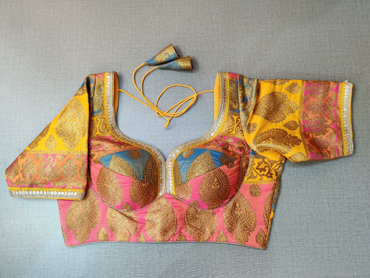 Buy this blouse as a rich add-on to glam up your look. The yellow blouse features multicolor embroidery, a beautiful U shape front and back, hook closure, and tie-up at back. Team this blouse with a lovely solid saree to look gorgeous and create a stunning and beautiful look. Buy this designer blouse in the USA from Pure Elegance. - Front View