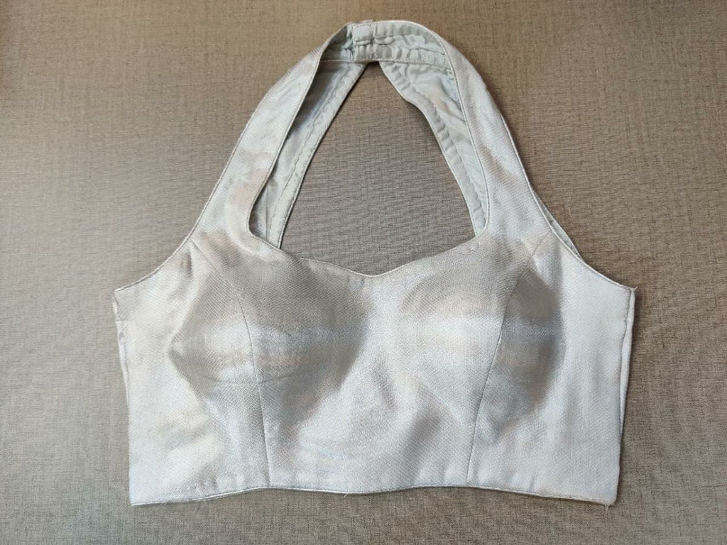 Buy and charm up your look and pair this white with your favorite saree. It has got a beautiful collar detailed, and hook closure, and to complete the look pair it with printed sarees. Buy it from Pure Elegance sari blouse from Pure Elegance Indian clothing store in the USA.- Front view