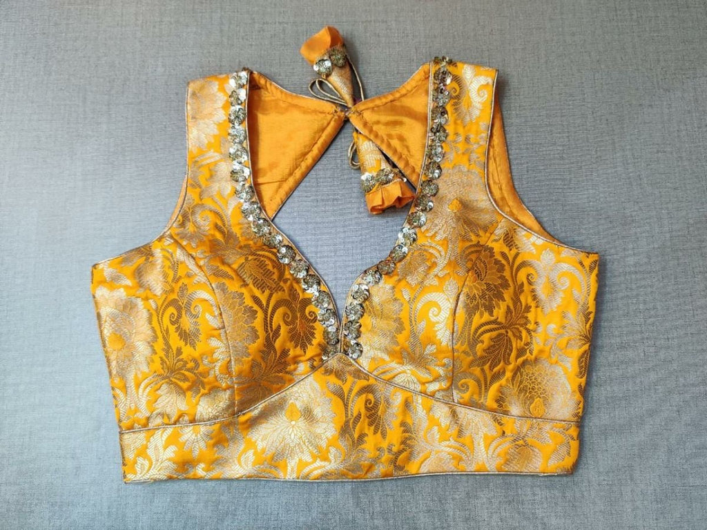 Buy classic is never old and enough to have in your closet !! this fashionable blouse features beautiful silk embroidery, a V-neck in front, and a beautiful back with a tie-up and hooks closure, Pair it with a beautiful saree and a statement neck piece and you are good to go!  Elevate your Indian saree style with exquisite readymade sari blouses, embroidered saree blouses, Banarasi sari blouses, and designer sari blouses from Pure Elegance Indian clothing store in the USA.- Front View