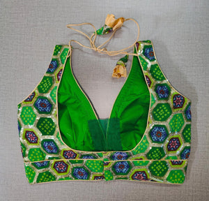 Beautifully designed green and blue bhandej printed saree blouse. Pair it with a bandhani saree and bhandej sarees to create a beautiful Indian festival look. Buy Indian saree blouses, readymade saree blouses, and designer blouses for sarees from Pure Elegance Indian fashion store in USA.-Back View