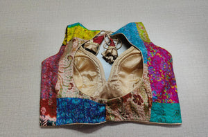 Buy an exquisite multi-color designer blouse. This blouse is great to buy. Pair this fashionable blouse with a beautiful crepe sarees and statement neckpiece and you're good to go! Elevate your Indian saree style with exquisite readymade sari blouse, embroidered saree blouses, Banarasi sari blouse, and designer sari blouse from Pure Elegance Indian clothing store in USA.-Back View
