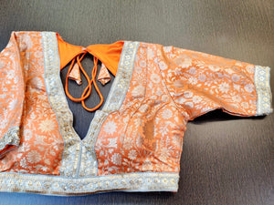 Buy stunning orange designer saree blouse online in USA with embroidered lace. Elevate your ethnic saree style with a tasteful collection of designer saree blouses, embroidered saree blouses, Banarasi saree blouse, silk sari blouse from Pure Elegance Indian clothing store in USA.-full view
