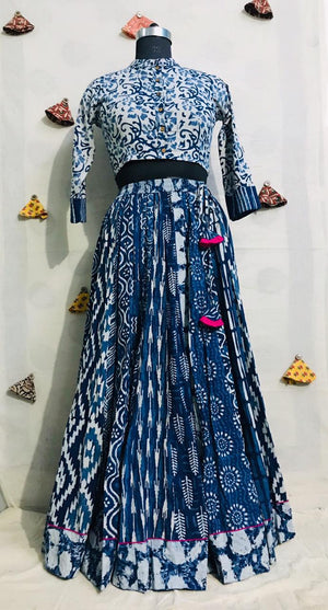 Buy gorgeous white and blue Bagru print cotton skirt set online in USA with dupatta. Elevate your ethnic style with a tasteful collection of designer Anarkali, designer salwar suits, Indian lehengas, sharara suits from Pure Elegance Indian clothing store in USA.-front