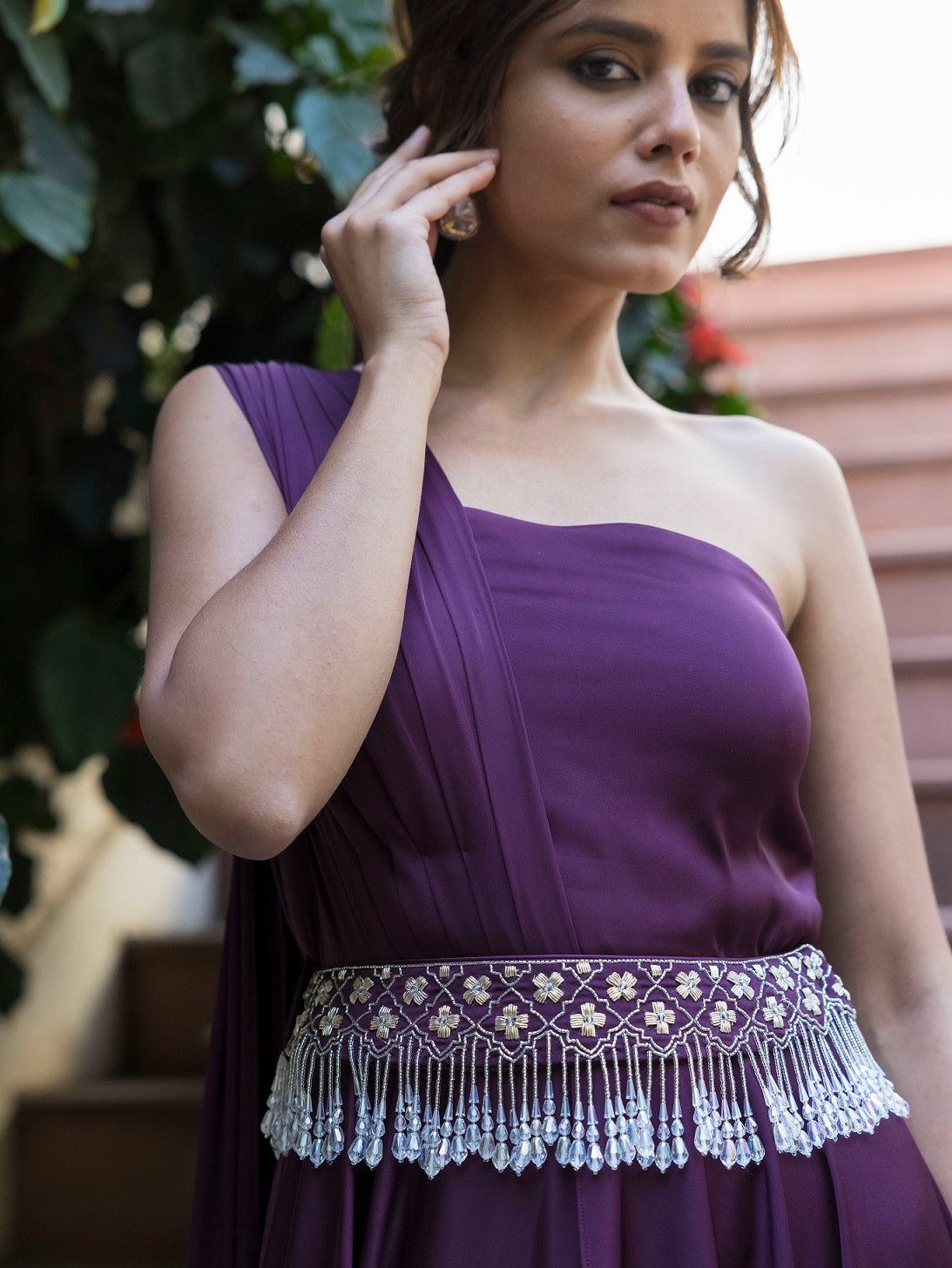 Buy stunning purple georgette one shoulder gown online in USA. Dazzle on weddings and special occasions with exquisite Indian designer dresses, sharara suits, Anarkali suits, wedding lehengas from Pure Elegance Indian fashion store in USA.-top