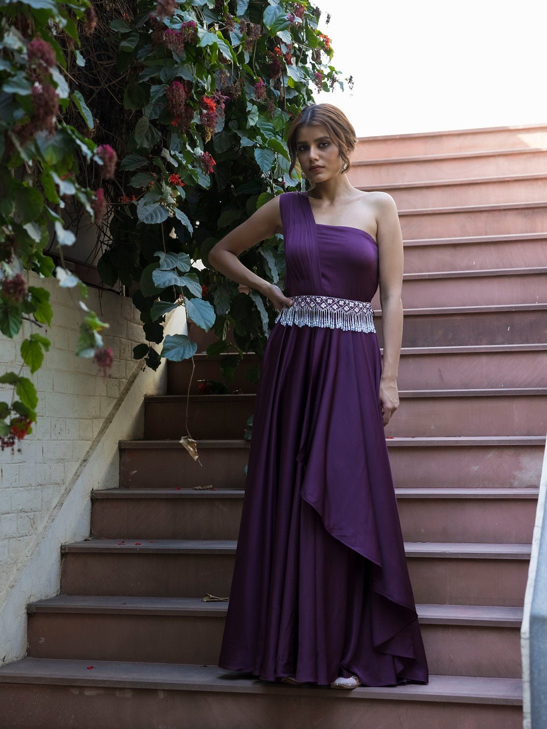 Buy stunning purple georgette one shoulder gown online in USA. Dazzle on weddings and special occasions with exquisite Indian designer dresses, sharara suits, Anarkali suits, wedding lehengas from Pure Elegance Indian fashion store in USA.-full view