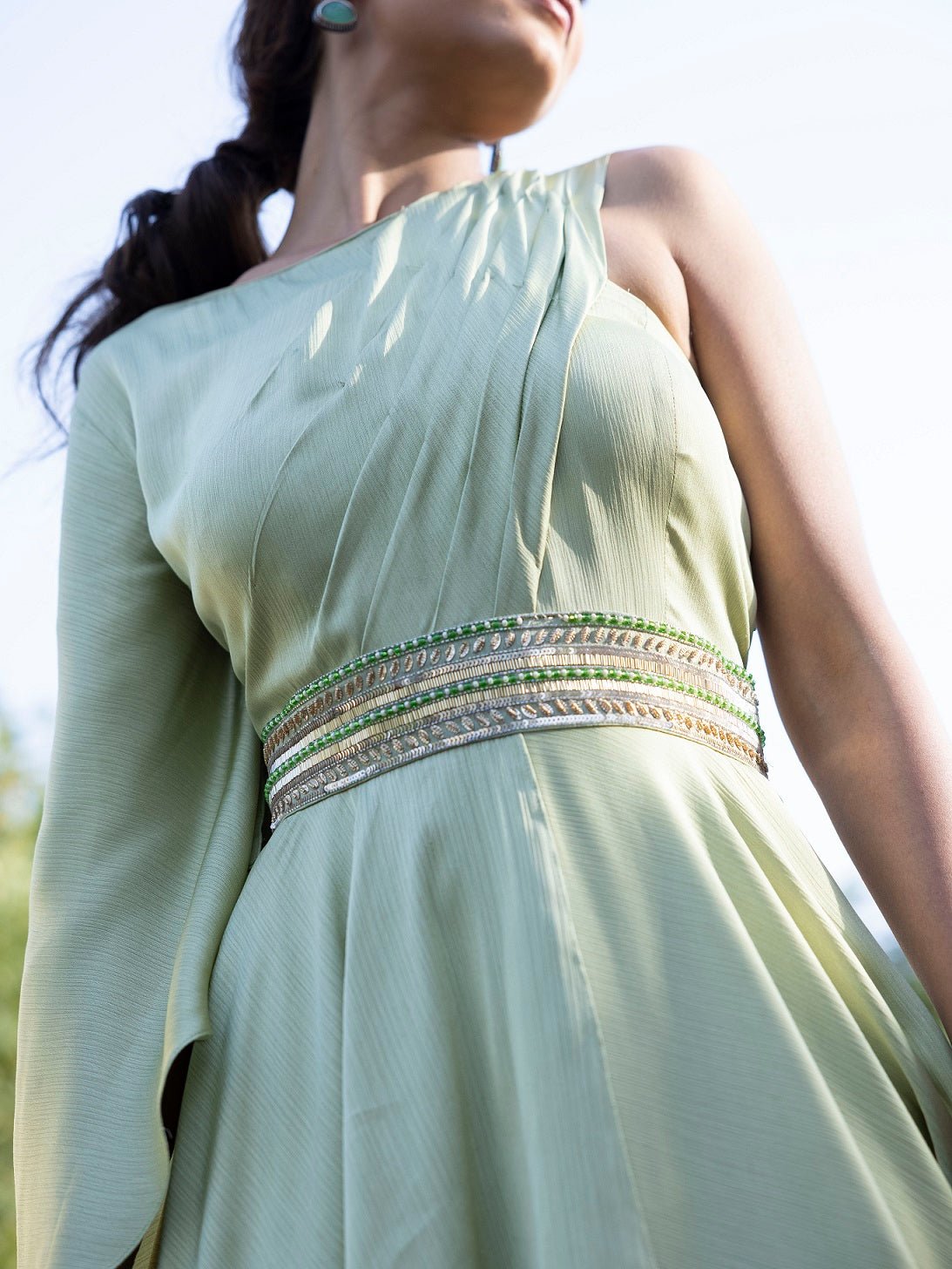Buy stunning pista green georgette one shoulder gown online in USA. Dazzle on weddings and special occasions with exquisite Indian designer dresses, sharara suits, Anarkali suits, wedding lehengas from Pure Elegance Indian fashion store in USA.-top