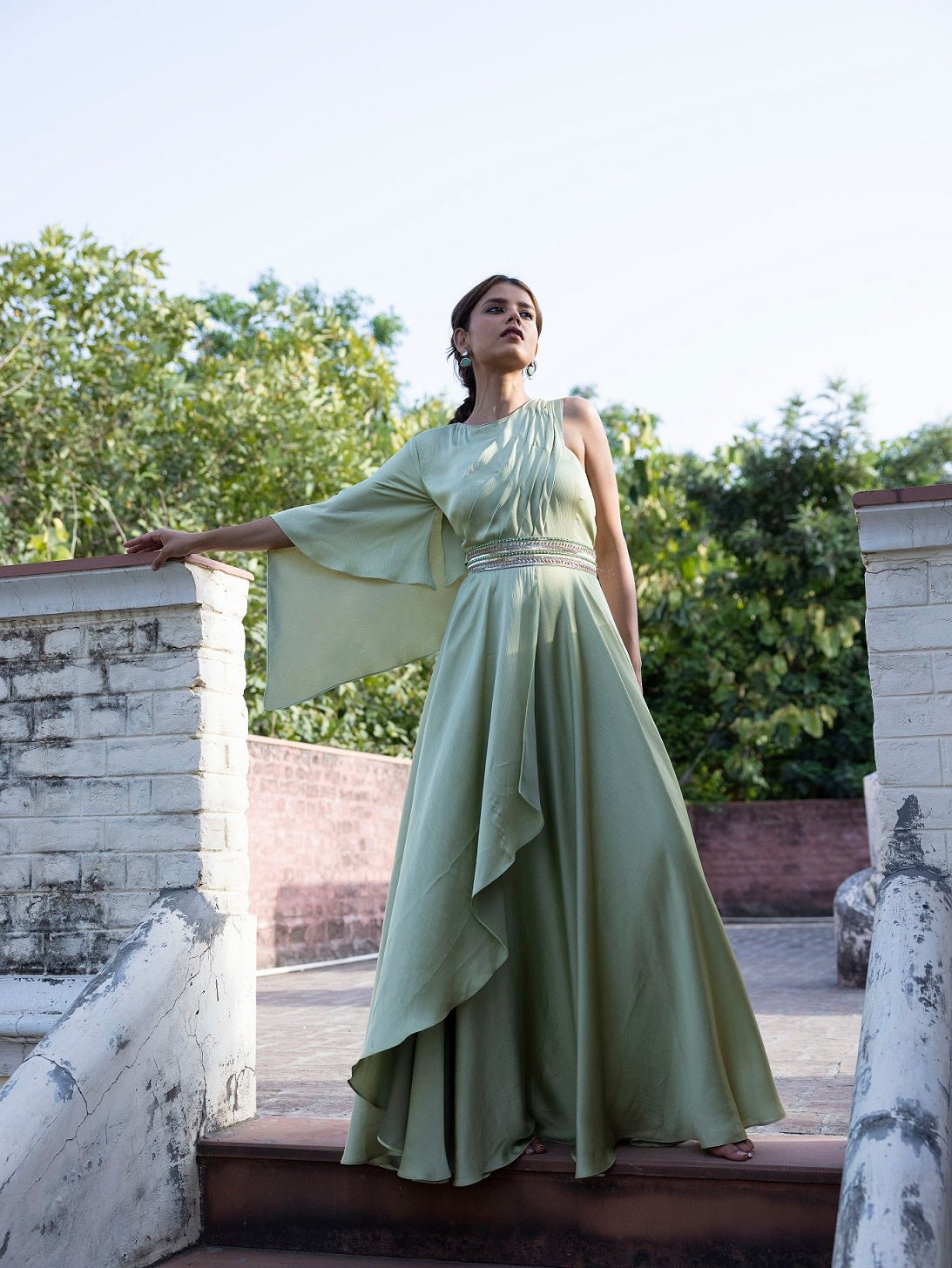 Buy stunning pista green georgette one shoulder gown online in USA. Dazzle on weddings and special occasions with exquisite Indian designer dresses, sharara suits, Anarkali suits, wedding lehengas from Pure Elegance Indian fashion store in USA.-flare
